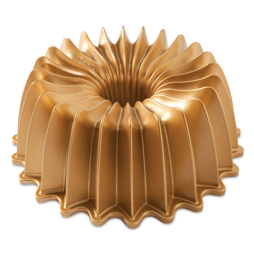 Gold fluted bundt pan with scalloped ridges and center hole
