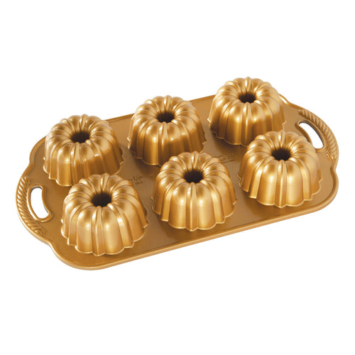 Gold-colored bundtlette pan with six mini bundt cavity molds