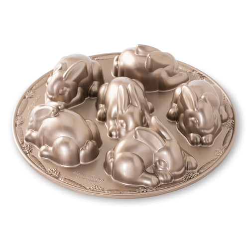 Round metal bunny cakelet mold pan with embossed bunny shapes and ridged rim