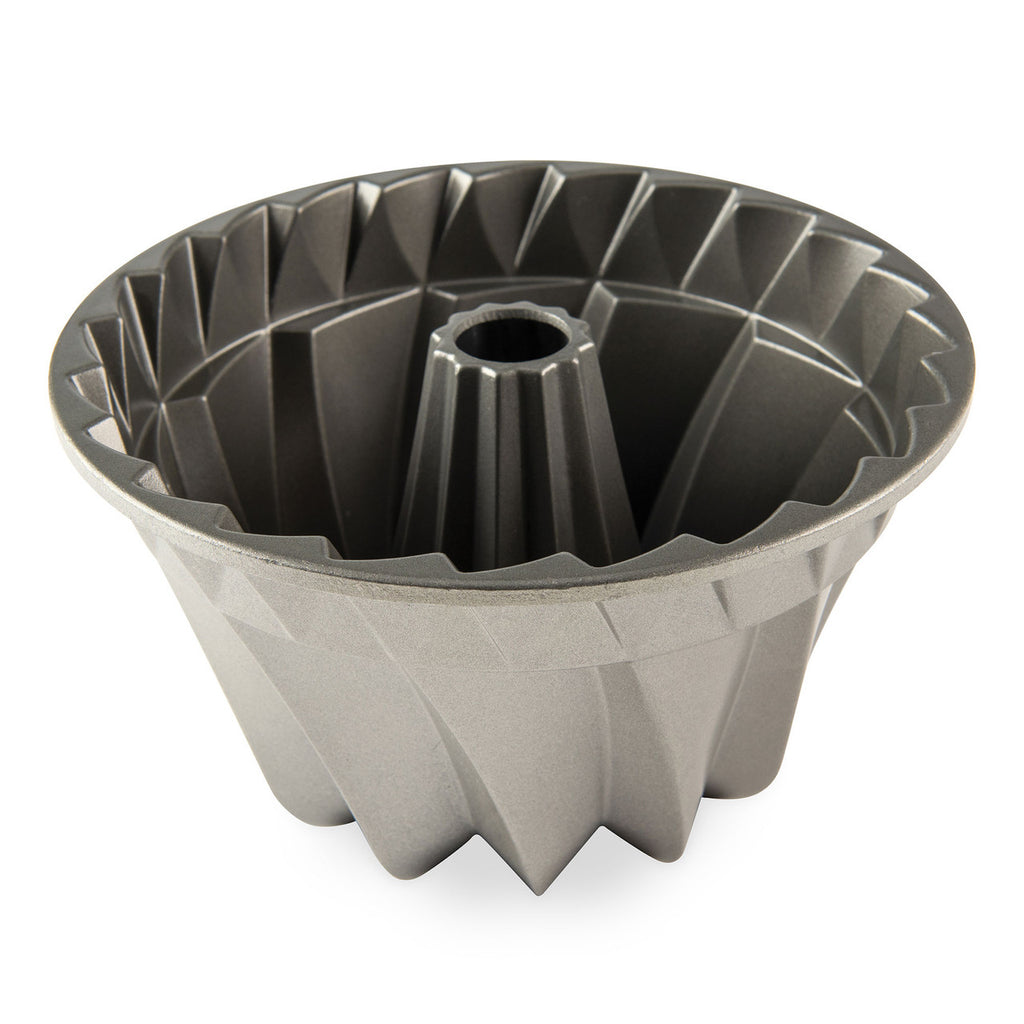 Bundt cake pan with dark nonstick interior, fluted ring mold and center tube