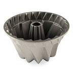 Bundt cake pan with dark nonstick interior, fluted ring mold and center tube