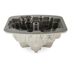 Gingerbread house bundt pan insert with central tube and geometric cavity details