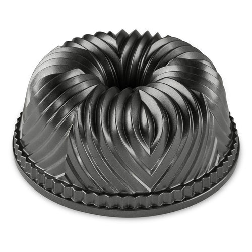 Black fluted Bundt pan with central tube and decorative ridges, round bakeware mold.