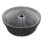 Gray fluted Bundt pan with central tube and ridged sides, round baking mold.