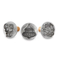 Three silver holiday cookie stamp molds with raised 3D cut-out patterns