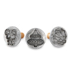 Three silver holiday cookie stamp molds with raised 3D cut-out patterns