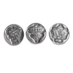 Three silver holiday cookie stamp molds featuring raised 3D patterns
