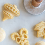 Close-up of stamped holiday cookies with embossed cut-out details